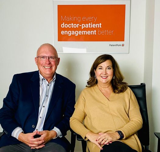 May be an image of 2 people and text that says 'Making every doctor- patient engagement better. PatientPointO CODEE'